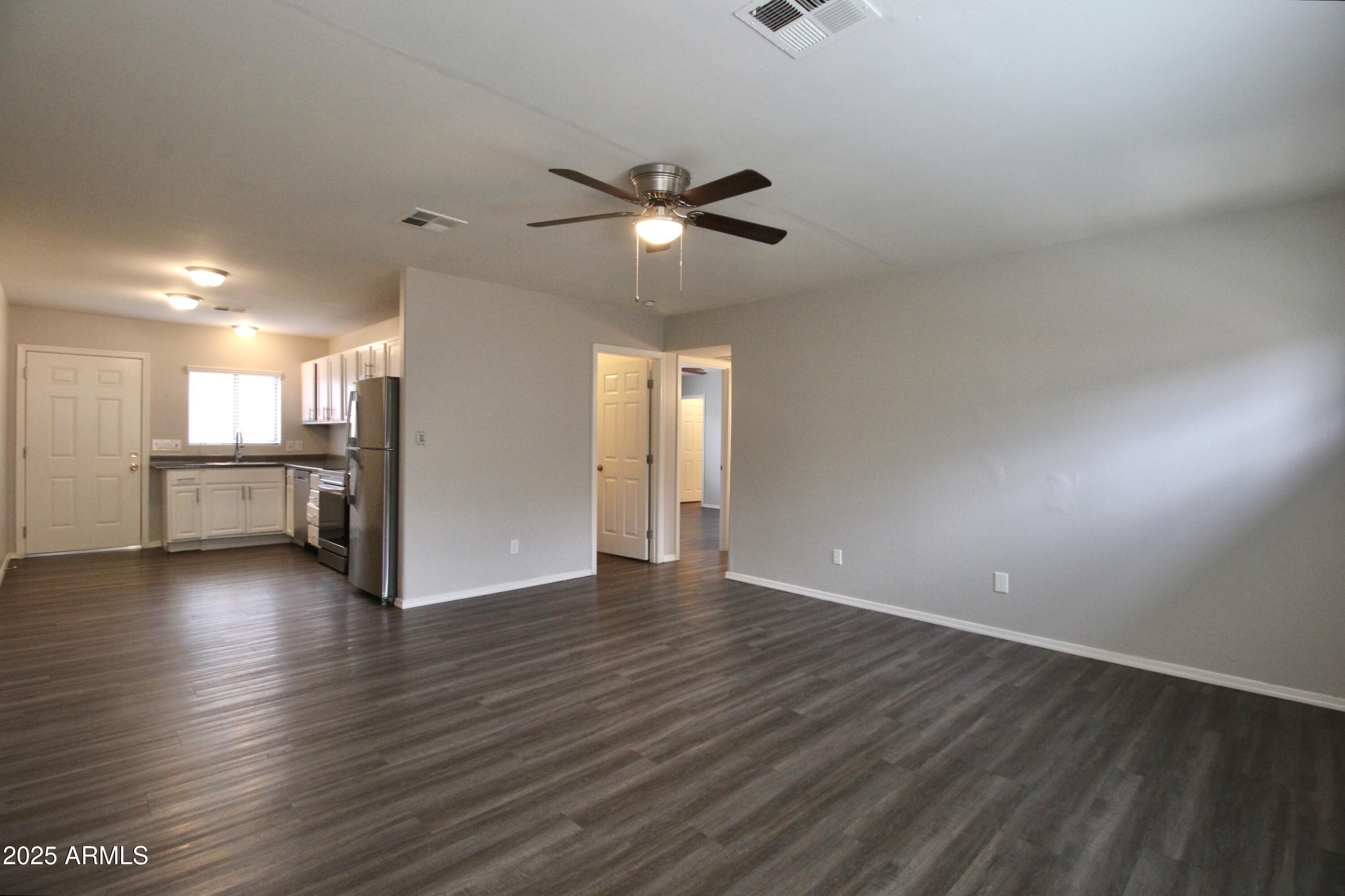 1732 West Maricopa Street, Unit 1 Phoenix, AZ 85007 - Photo 8 of 30 a view of a kitchen with wooden floor and a kitchen