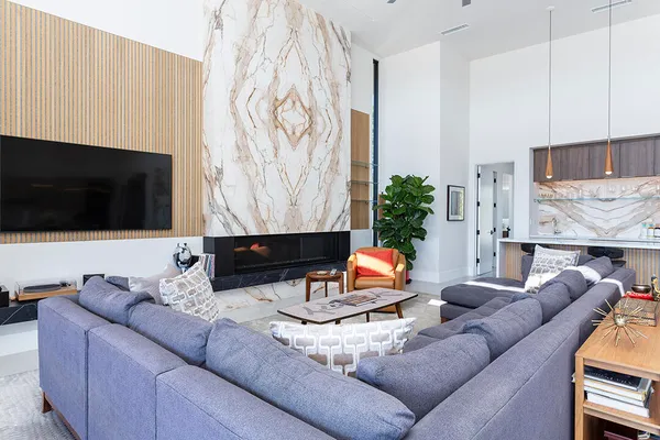 a large kitchen with a table and chairs