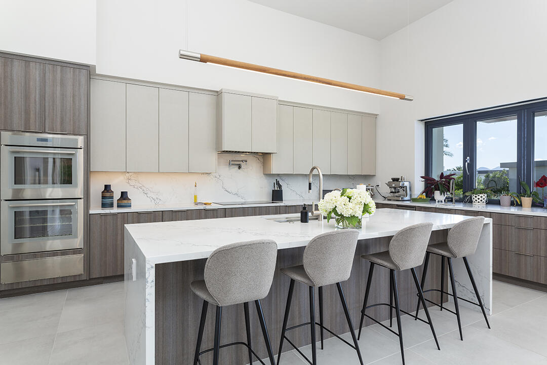 72145 Vía Vail Rancho Mirage, CA 92270 - Photo 14 of 68 a kitchen with stainless steel appliances granite countertop a table chairs sink and cabinets