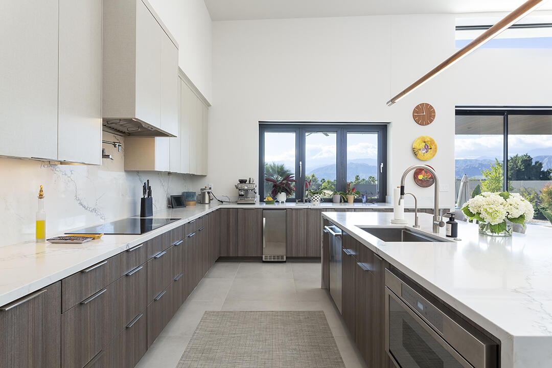 72145 Vía Vail Rancho Mirage, CA 92270 - Photo 17 of 68 a large kitchen with stainless steel appliances granite countertop a sink and a large window