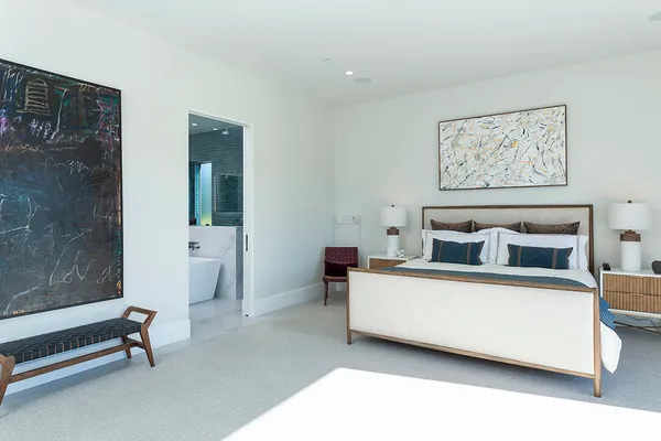 a bedroom with furniture and flat screen tv