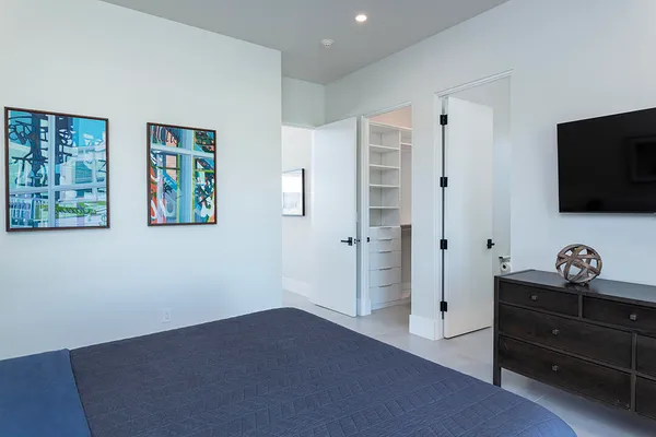 a view of a livingroom with furniture and a book shelf