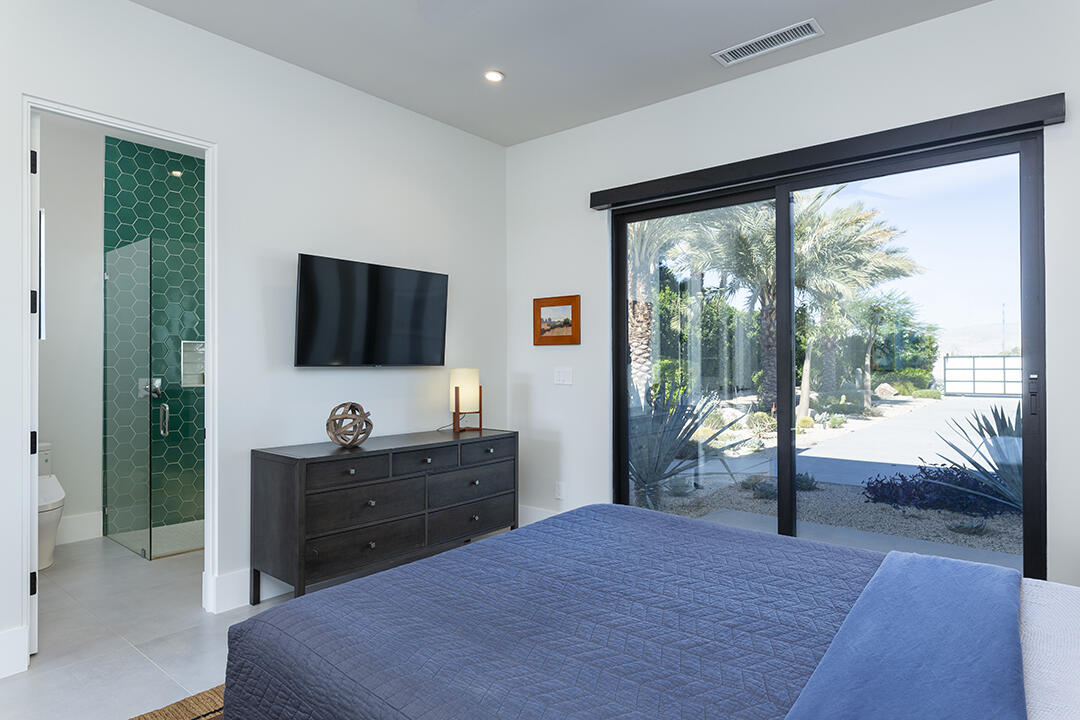 72145 Vía Vail Rancho Mirage, CA 92270 - Photo 39 of 68 a bedroom with a bed and a flat screen tv