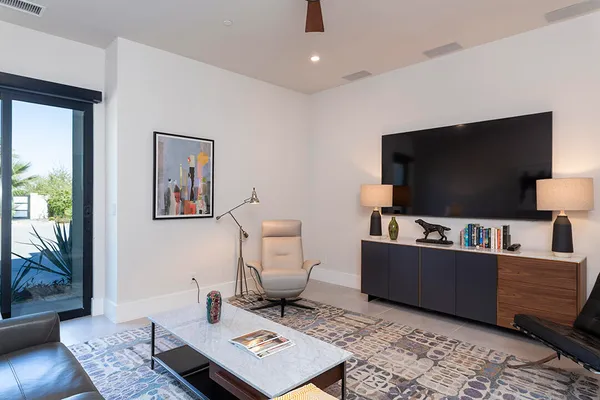 a bedroom with a bed and a view of balcony