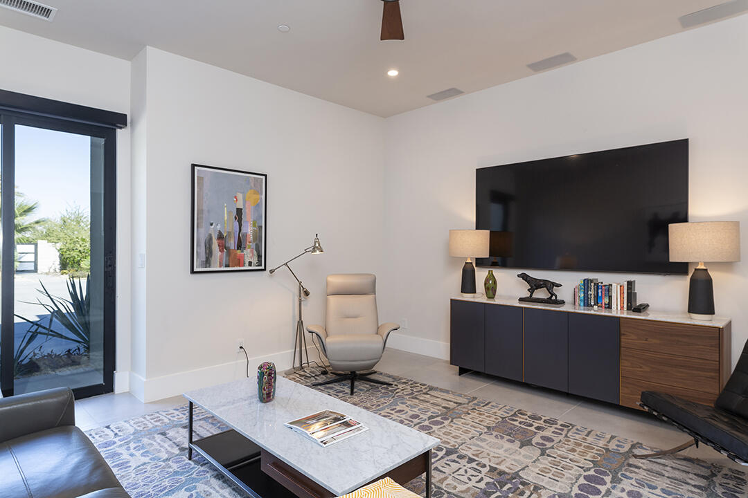 72145 Vía Vail Rancho Mirage, CA 92270 - Photo 42 of 68 a living room with furniture and a flat screen tv