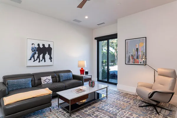 a bedroom with a bed and a lamp