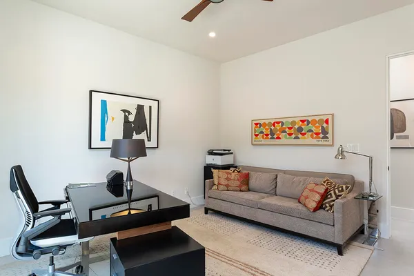a white toilet sitting next to a bathroom sink