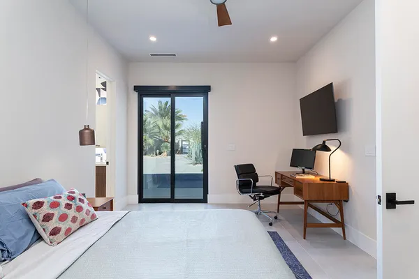 a view of a kitchen with refrigerator and windows