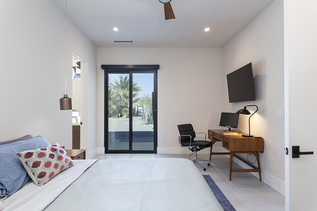 72145 Vía Vail Rancho Mirage, CA 92270 - Photo 50 of 68 a bedroom with furniture and a window