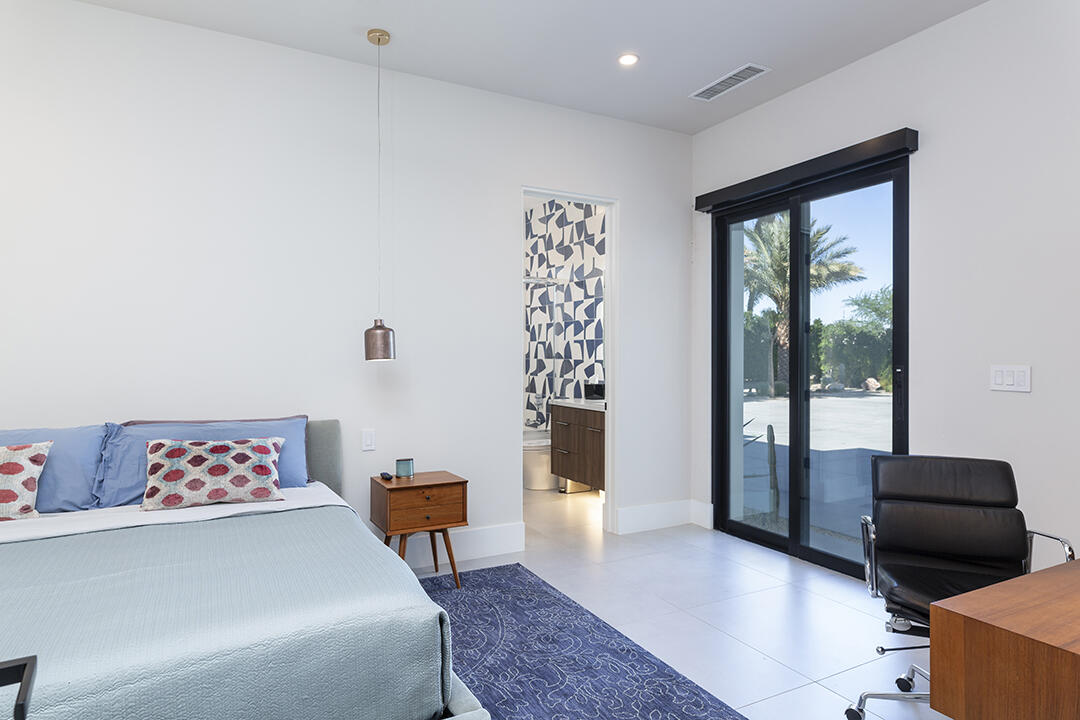 72145 Vía Vail Rancho Mirage, CA 92270 - Photo 52 of 68 a bedroom with furniture and a large window