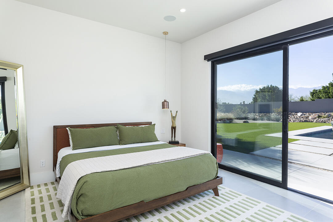 72145 Vía Vail Rancho Mirage, CA 92270 - Photo 55 of 68 a bedroom with a bed and a view of balcony