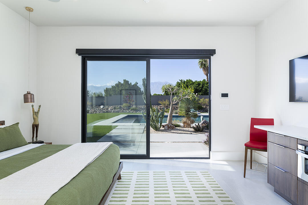 72145 Vía Vail Rancho Mirage, CA 92270 - Photo 59 of 68 a living room with furniture and a floor to ceiling window