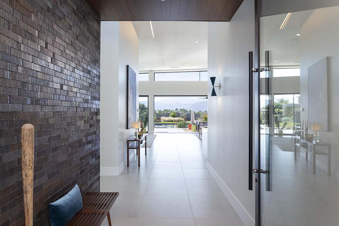 72145 Vía Vail Rancho Mirage, CA 92270 - Photo 6 of 68 a hallway with a view of living room with furniture