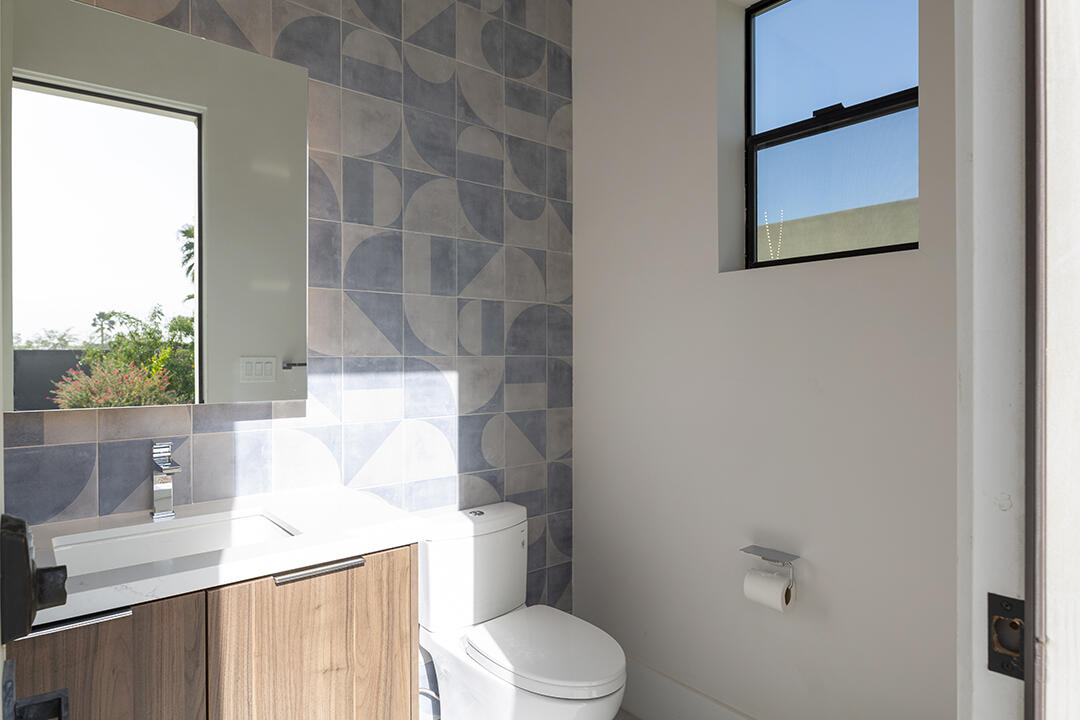 72145 Vía Vail Rancho Mirage, CA 92270 - Photo 62 of 68 a white toilet sitting next to a bathroom sink