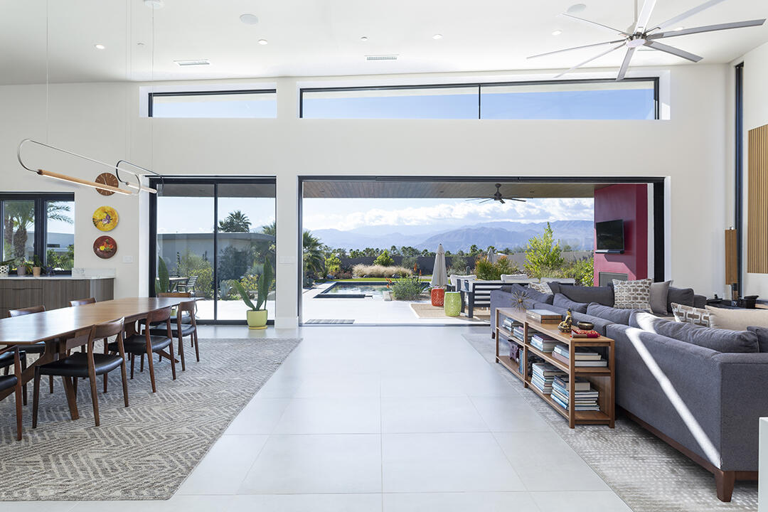 72145 Vía Vail Rancho Mirage, CA 92270 - Photo 7 of 68 a room with lots of tables a large window and chairs