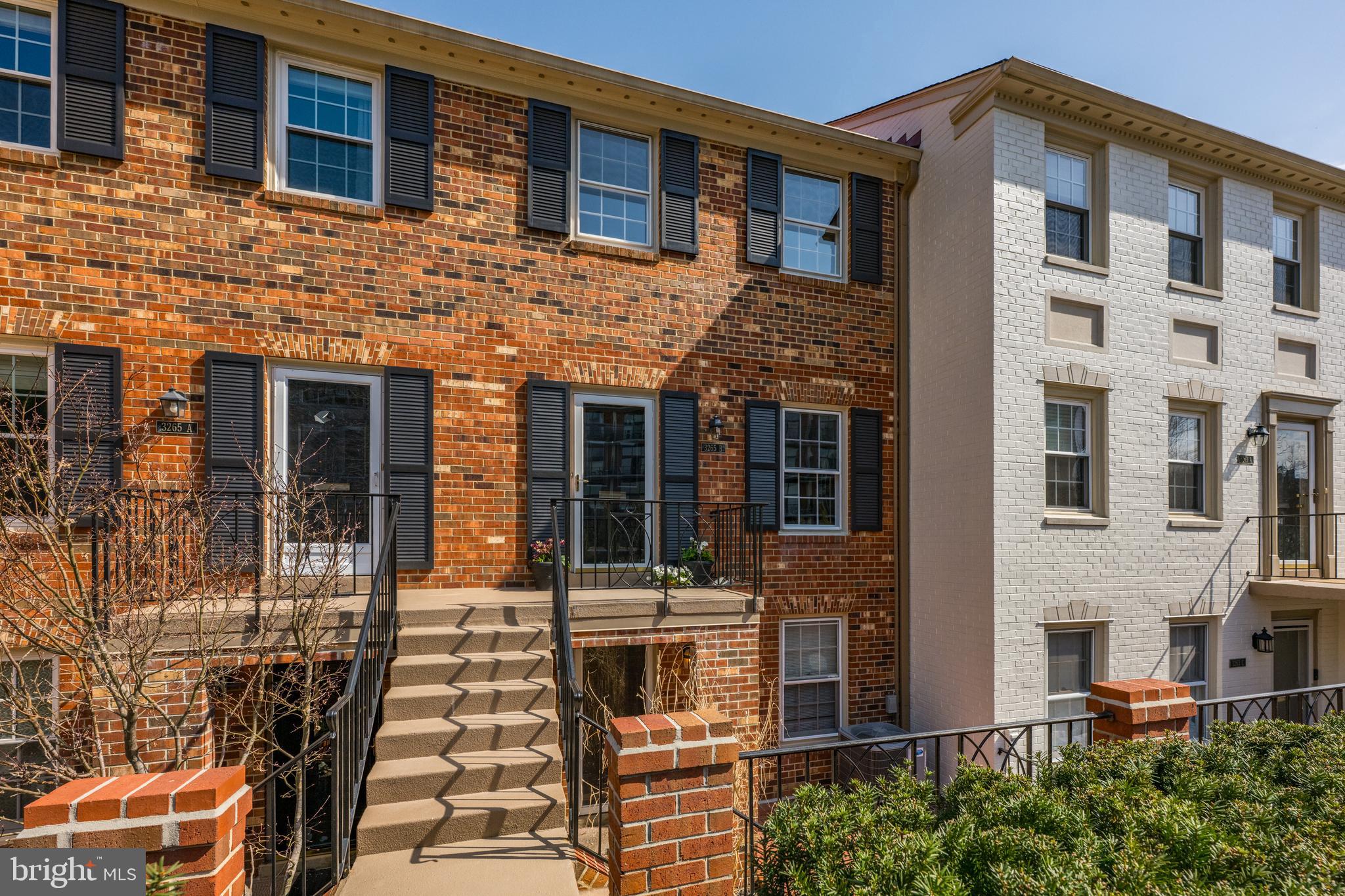 3265 Sutton Place Northwest, Unit B Washington, DC 20016 - Photo 1 of 45 a front view of a building with glass windows