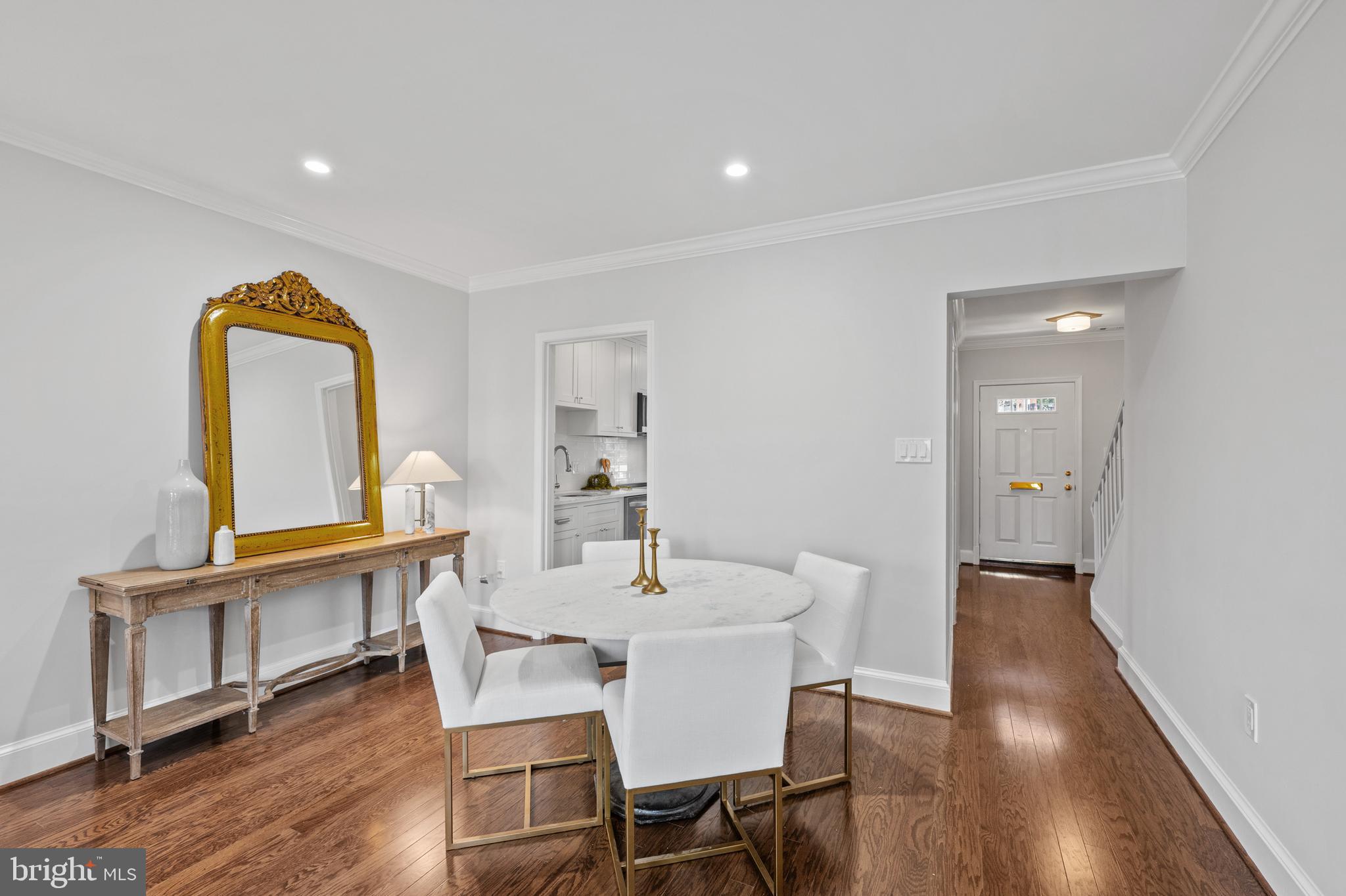 3265 Sutton Place Northwest, Unit B Washington, DC 20016 - Photo 15 of 45 a view of a dining room with furniture and wooden floor