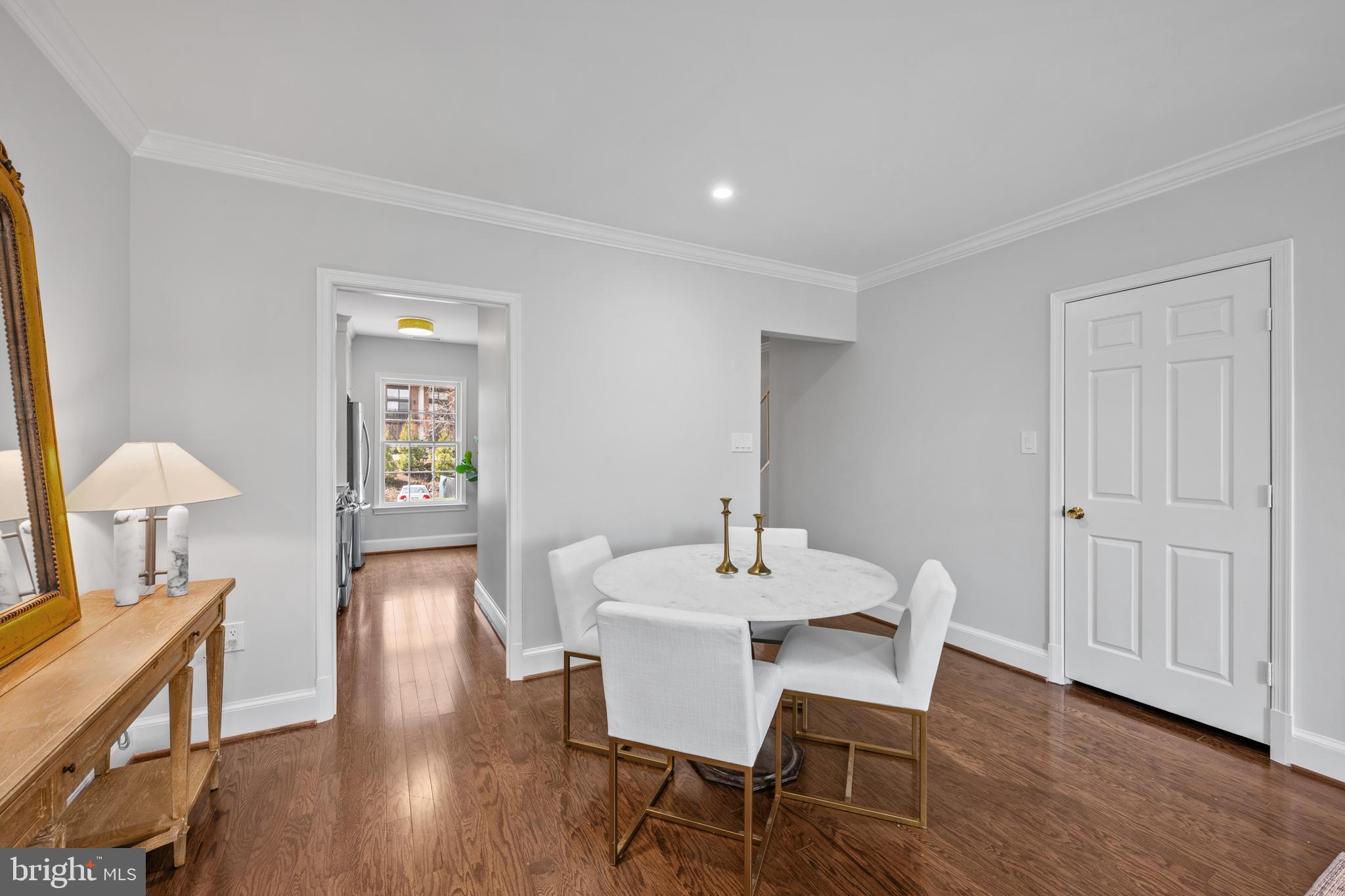 3265 Sutton Place Northwest, Unit B Washington, DC 20016 - Photo 16 of 45 a view of a dining room with furniture window and wooden floor