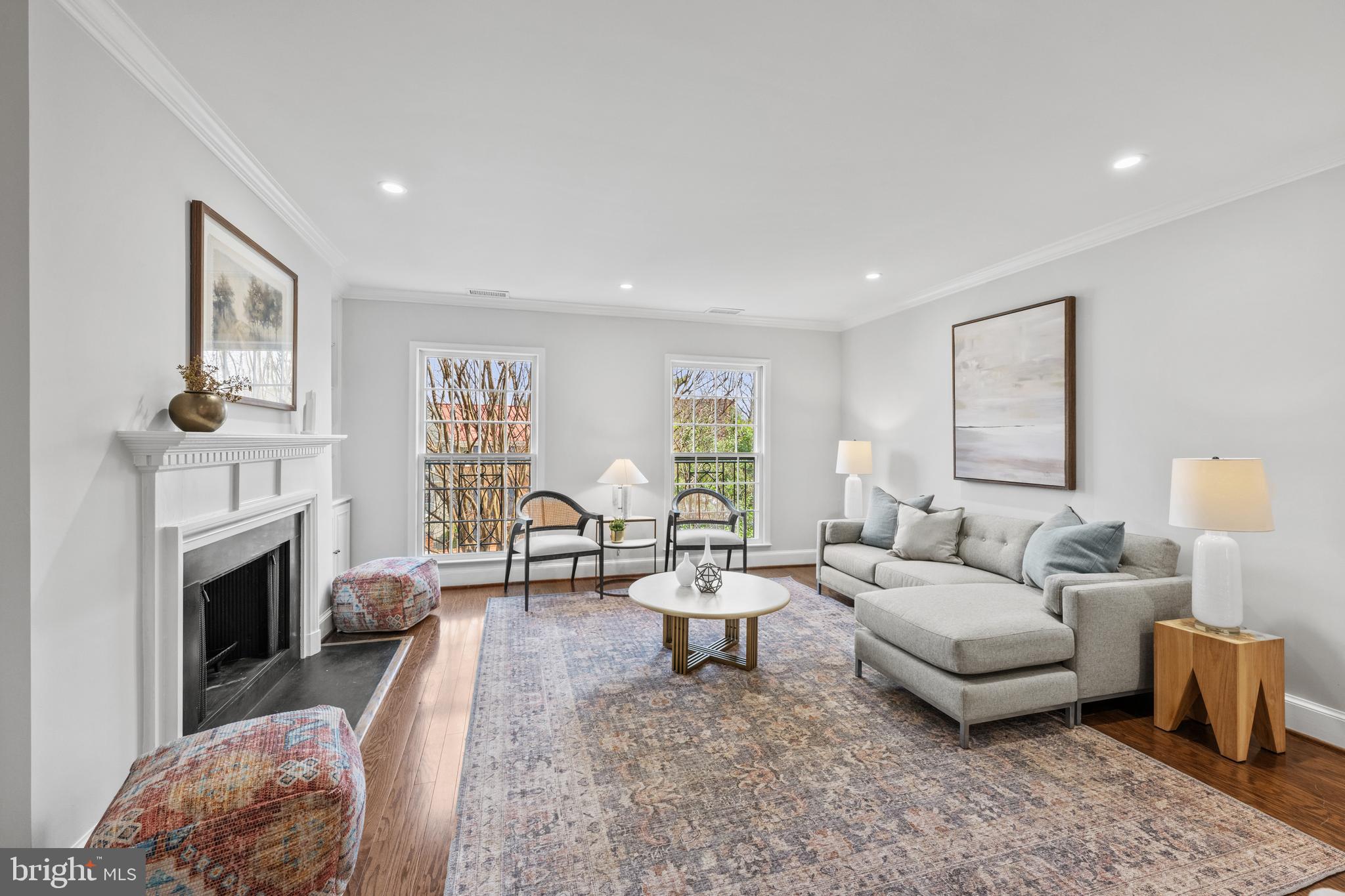 3265 Sutton Place Northwest, Unit B Washington, DC 20016 - Photo 17 of 45 a living room with furniture a fireplace and a table