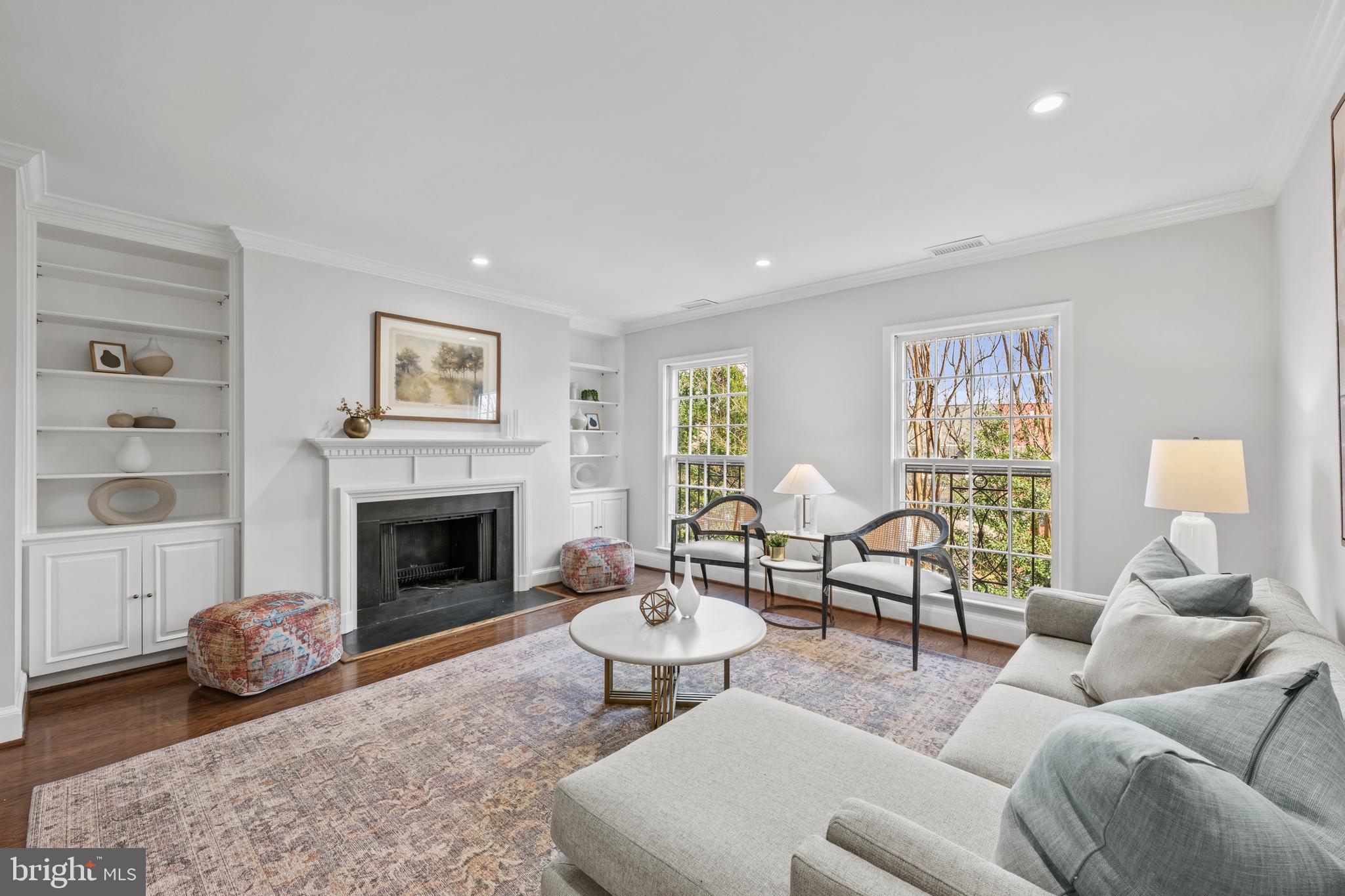 3265 Sutton Place Northwest, Unit B Washington, DC 20016 - Photo 19 of 45 a living room with furniture and a fireplace
