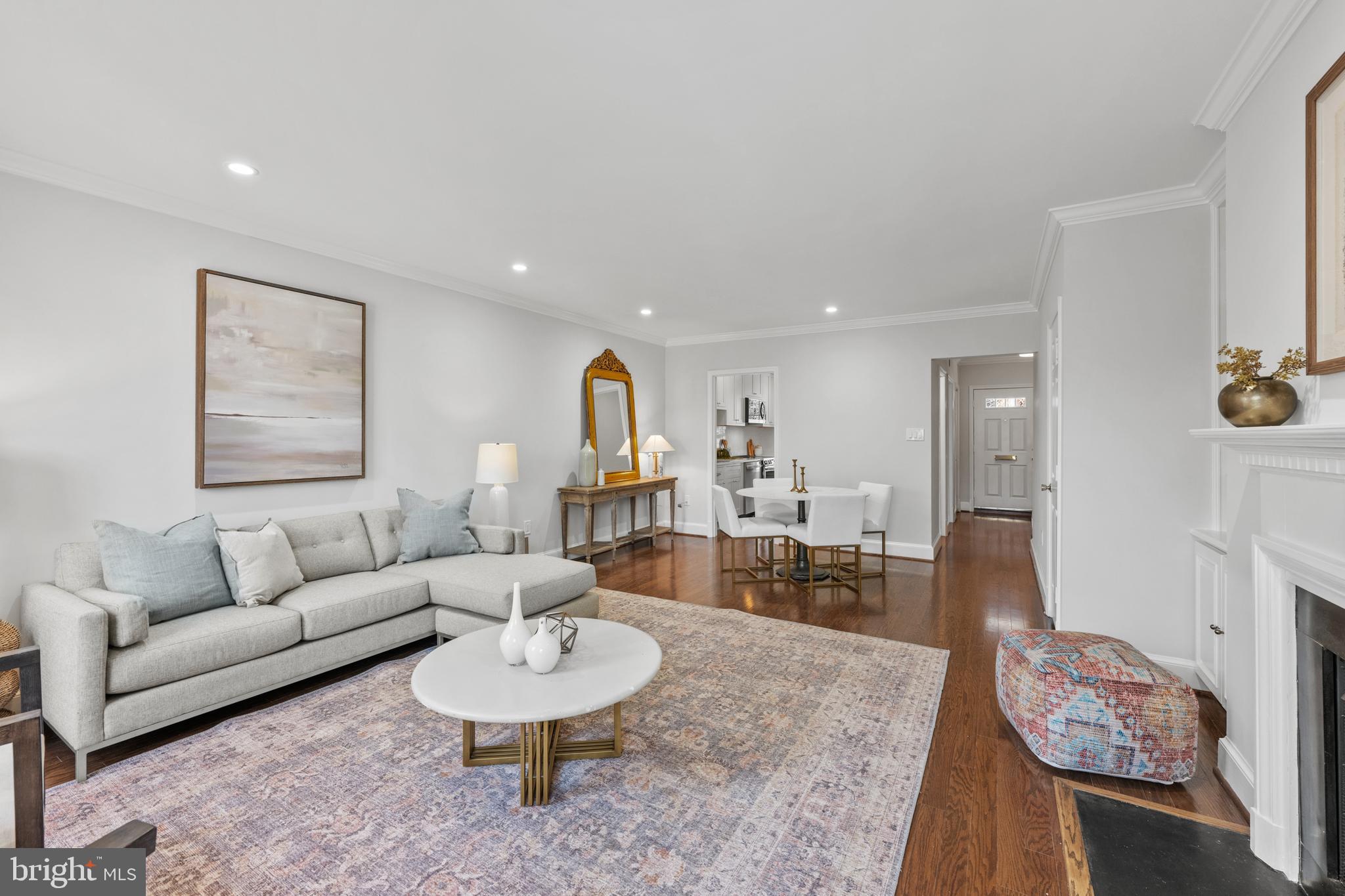 3265 Sutton Place Northwest, Unit B Washington, DC 20016 - Photo 20 of 45 a living room with furniture and a wooden floor