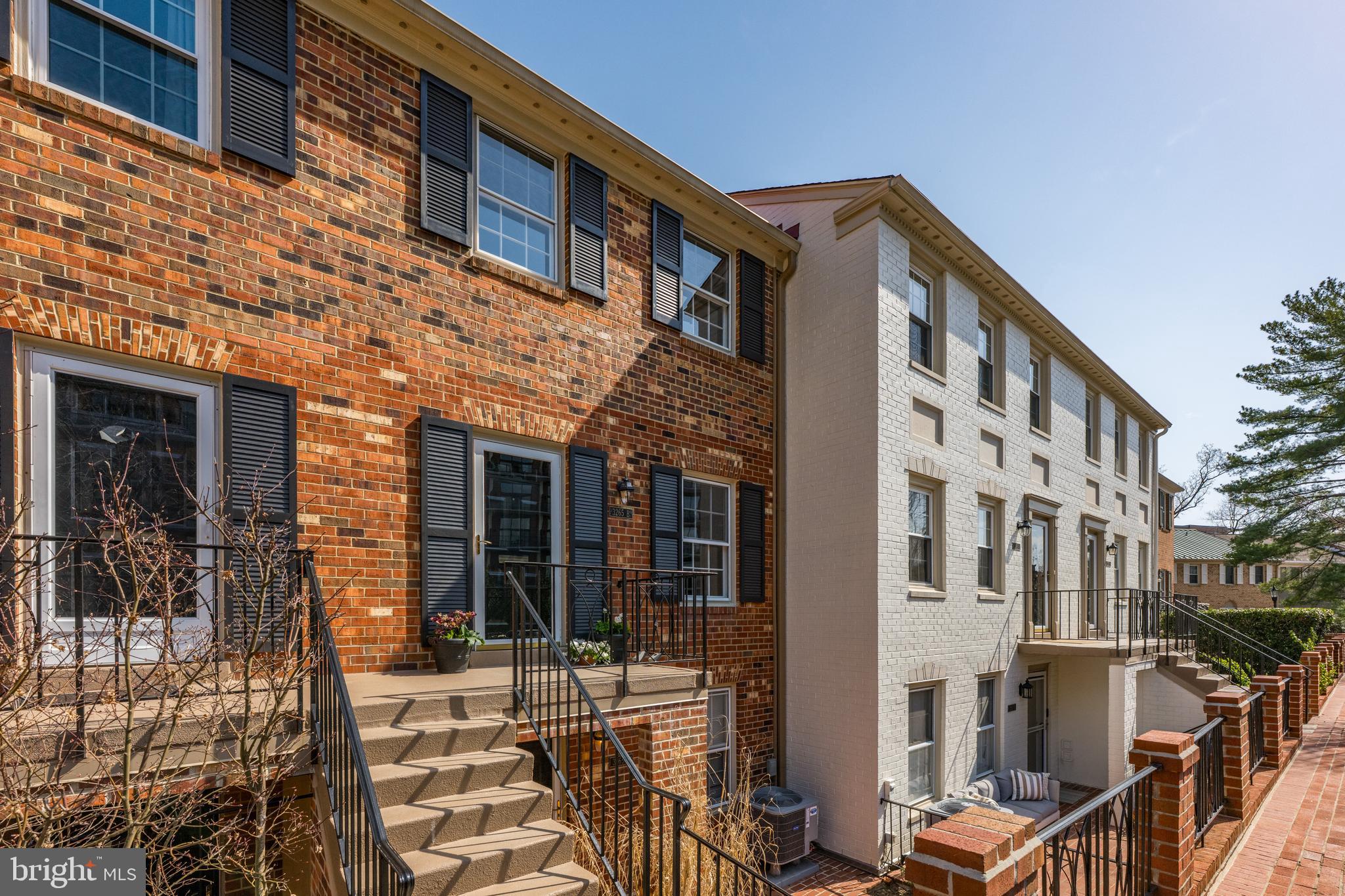 3265 Sutton Place Northwest, Unit B Washington, DC 20016 - Photo 2 of 45 a front view of a building with glass door