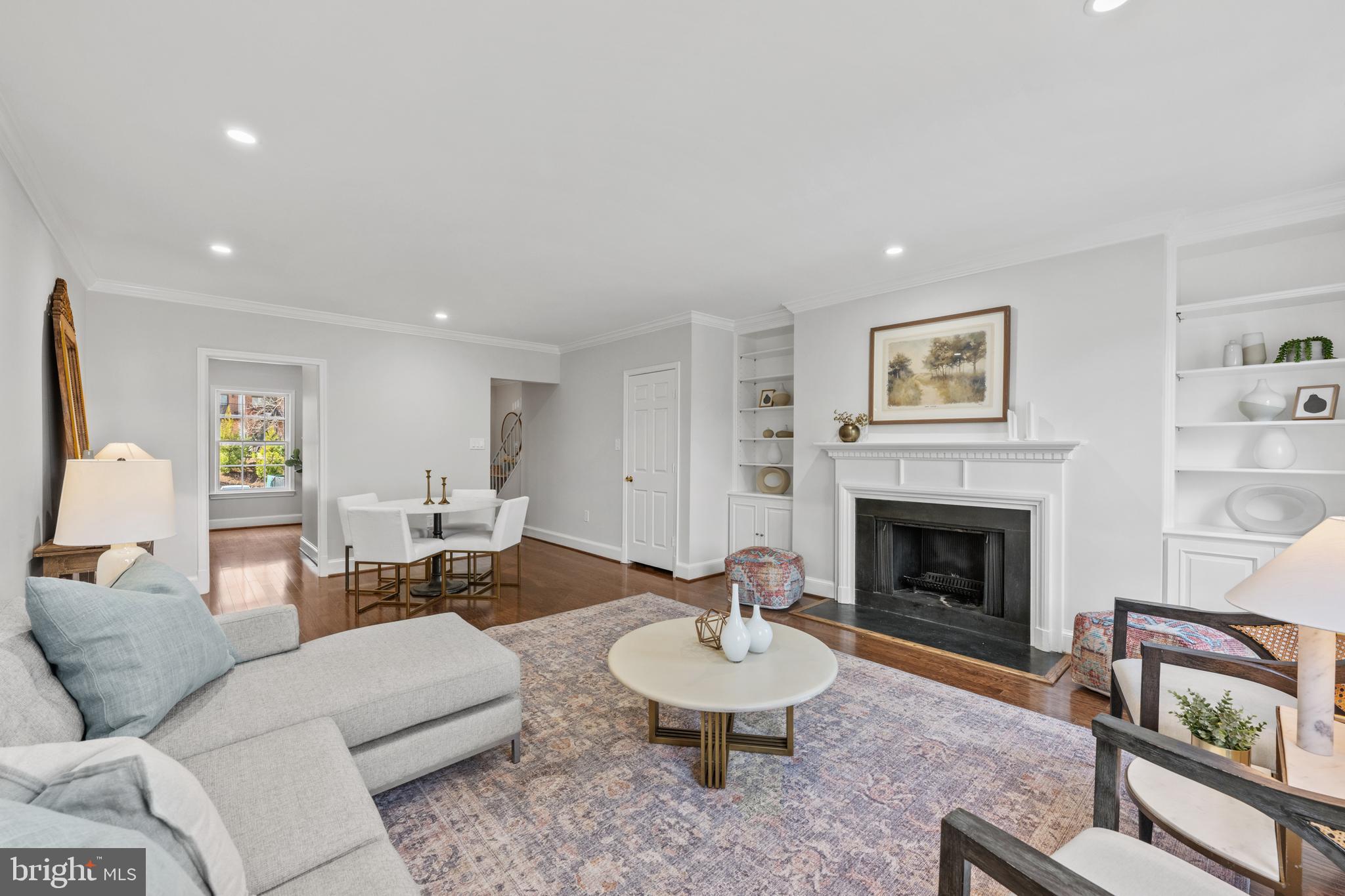 3265 Sutton Place Northwest, Unit B Washington, DC 20016 - Photo 21 of 45 a living room with furniture and a fireplace
