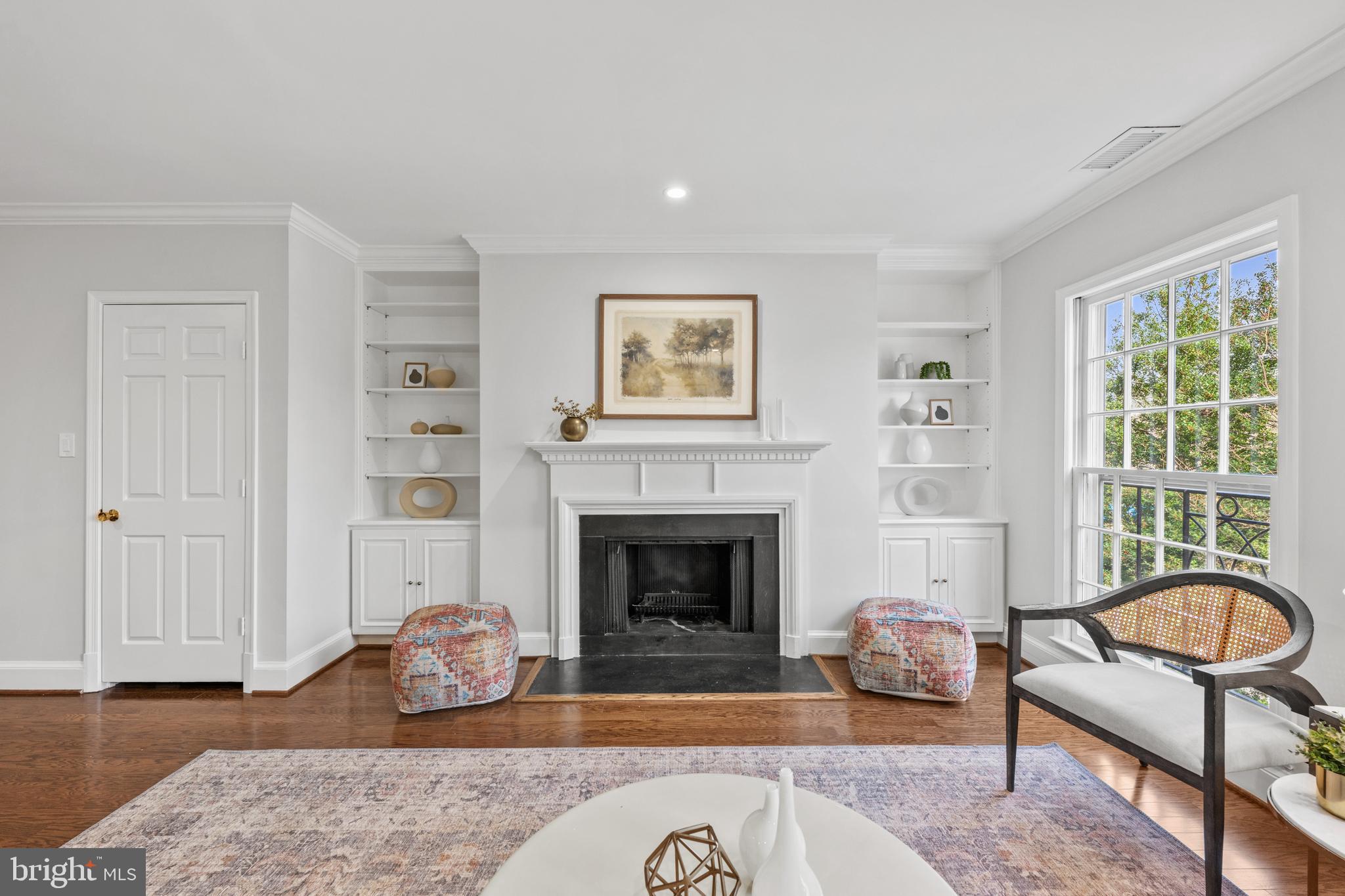 3265 Sutton Place Northwest, Unit B Washington, DC 20016 - Photo 22 of 45 a living room with furniture windows and a fireplace