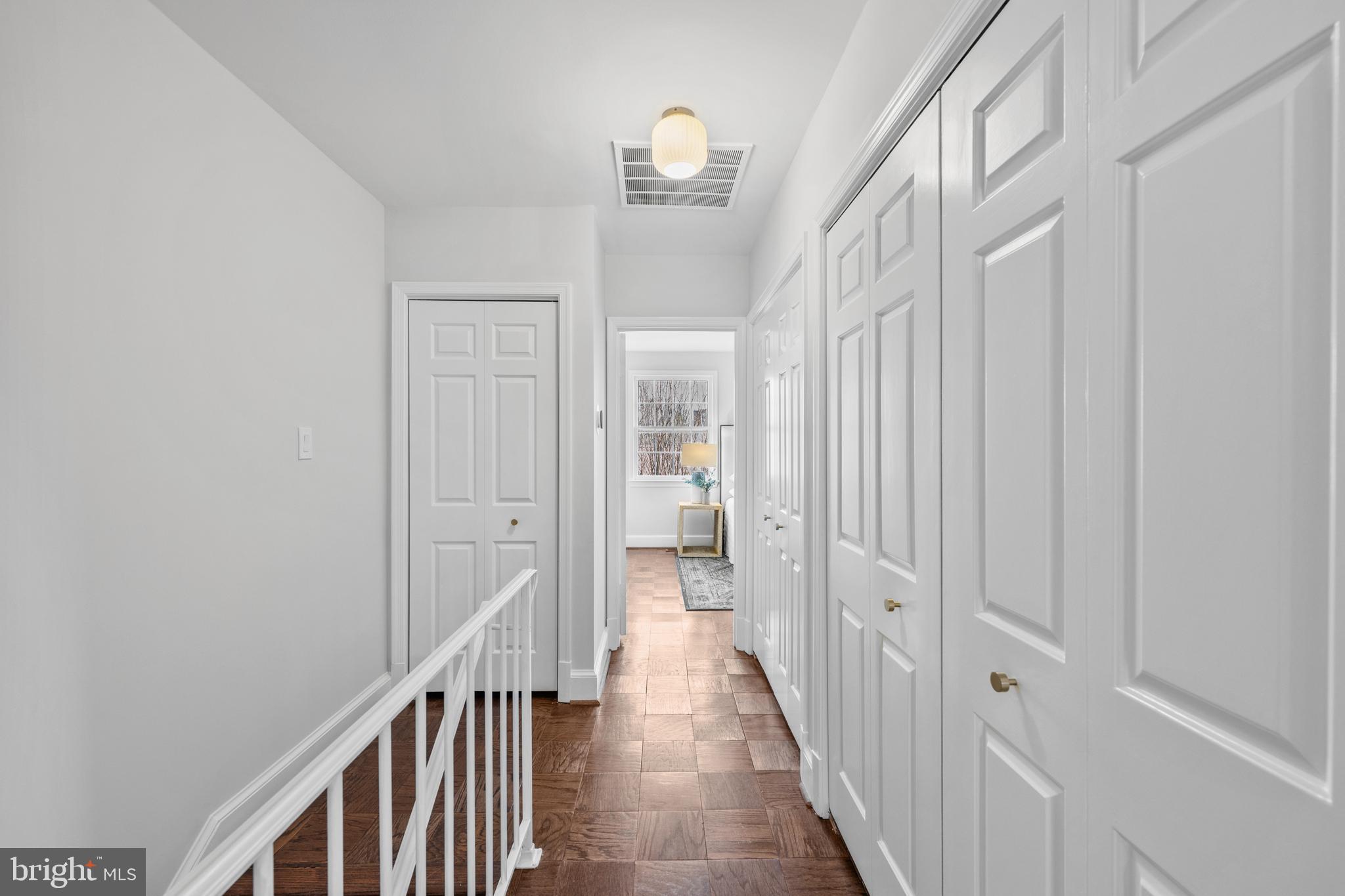 3265 Sutton Place Northwest, Unit B Washington, DC 20016 - Photo 25 of 45 a view of a hallway with wooden floor and entryway