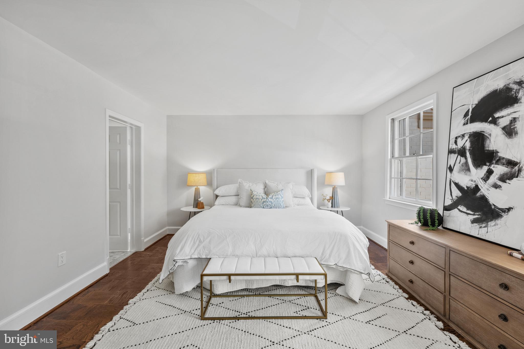 3265 Sutton Place Northwest, Unit B Washington, DC 20016 - Photo 27 of 45 a bedroom with a bed and a dresser