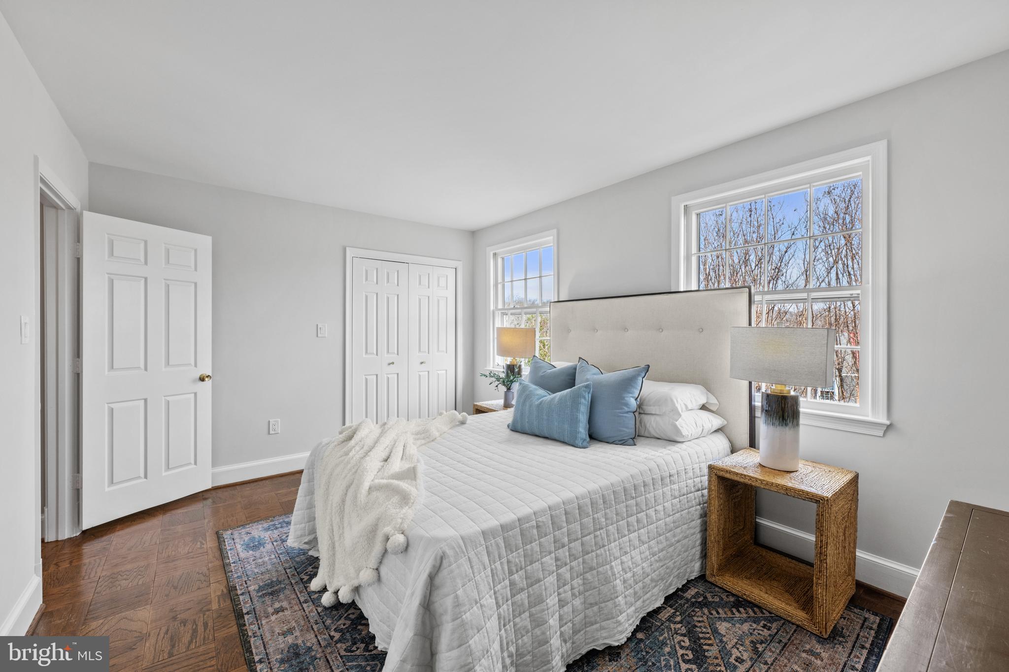 3265 Sutton Place Northwest, Unit B Washington, DC 20016 - Photo 33 of 45 a bedroom with a bed and wooden floor