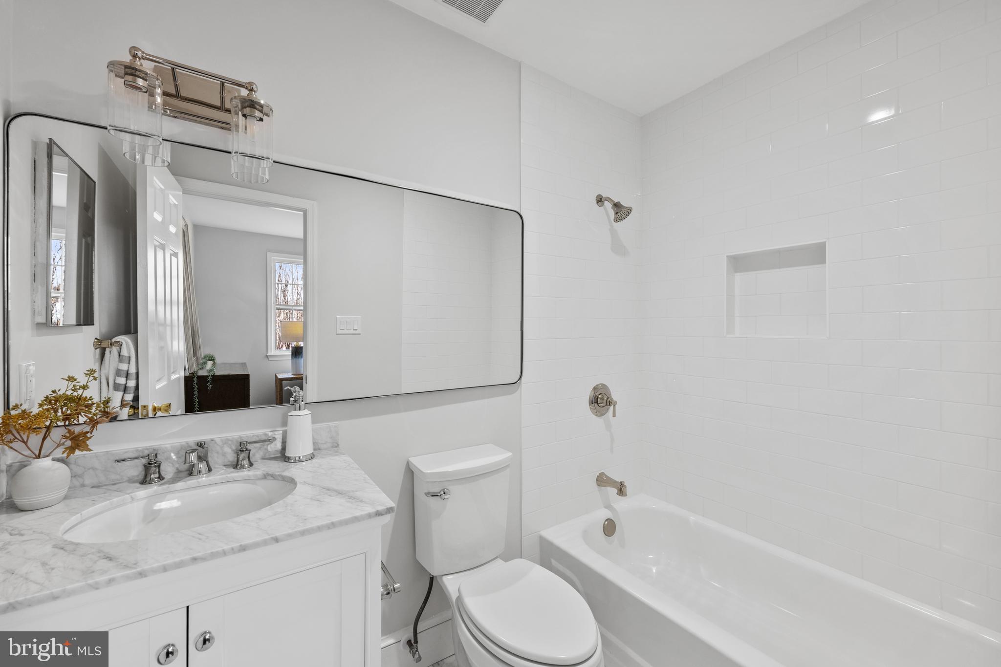 3265 Sutton Place Northwest, Unit B Washington, DC 20016 - Photo 35 of 45 a bathroom with a granite countertop sink toilet and shower