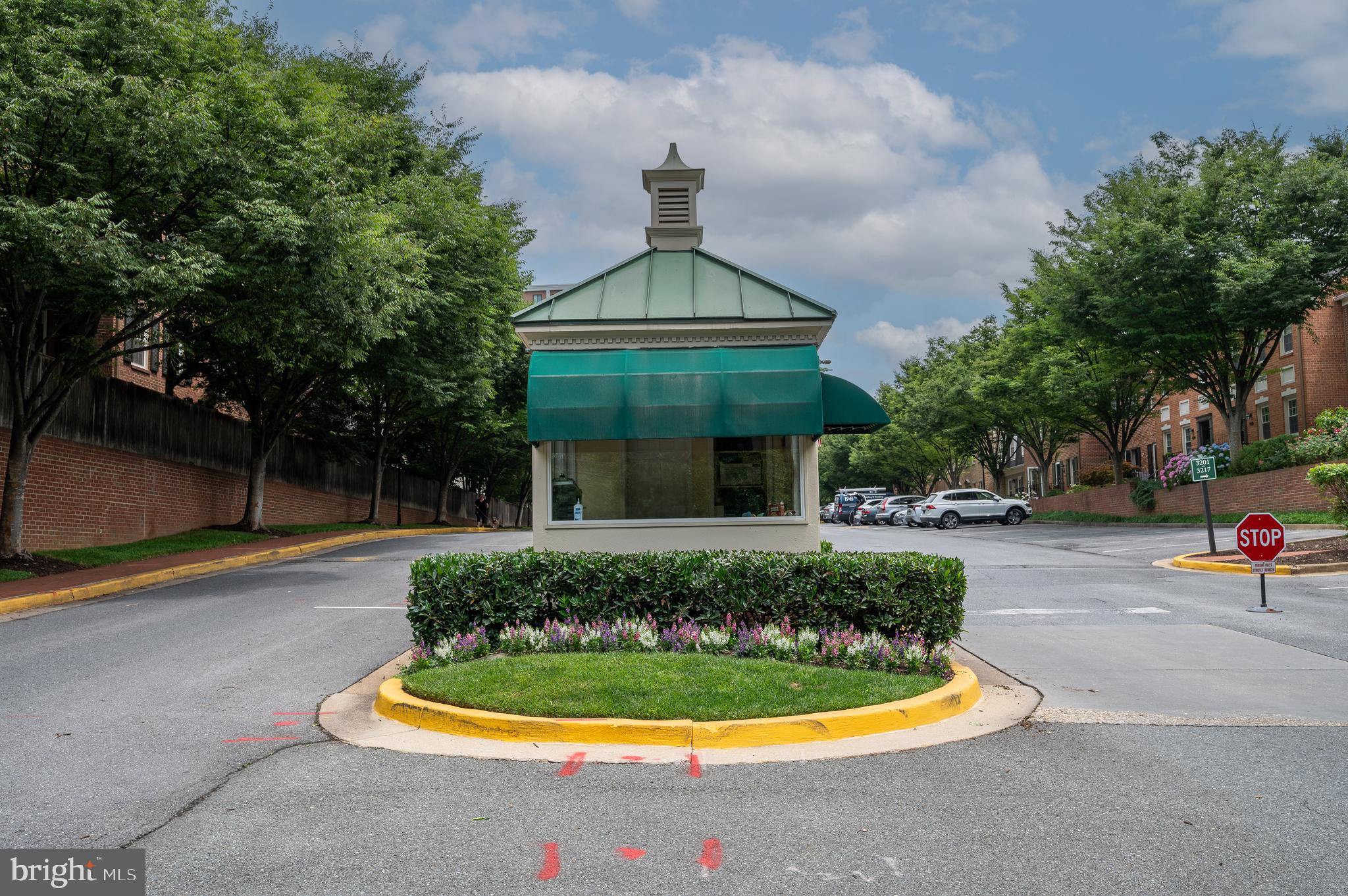 3265 Sutton Place Northwest, Unit B Washington, DC 20016 - Photo 37 of 45 a front view of a house with swimming pool fire pit and outdoor seating