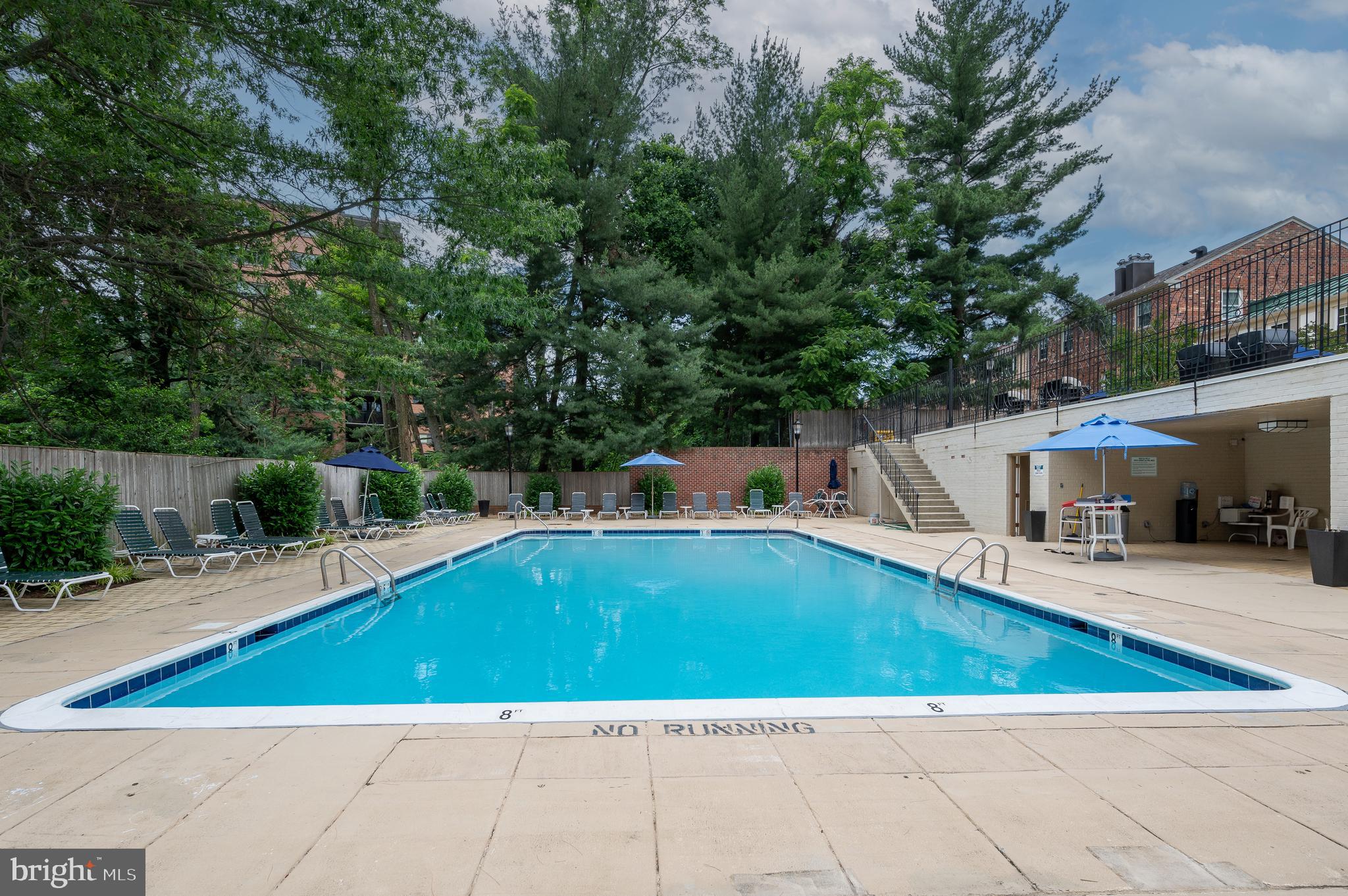 3265 Sutton Place Northwest, Unit B Washington, DC 20016 - Photo 39 of 45 a view of a swimming pool with a patio