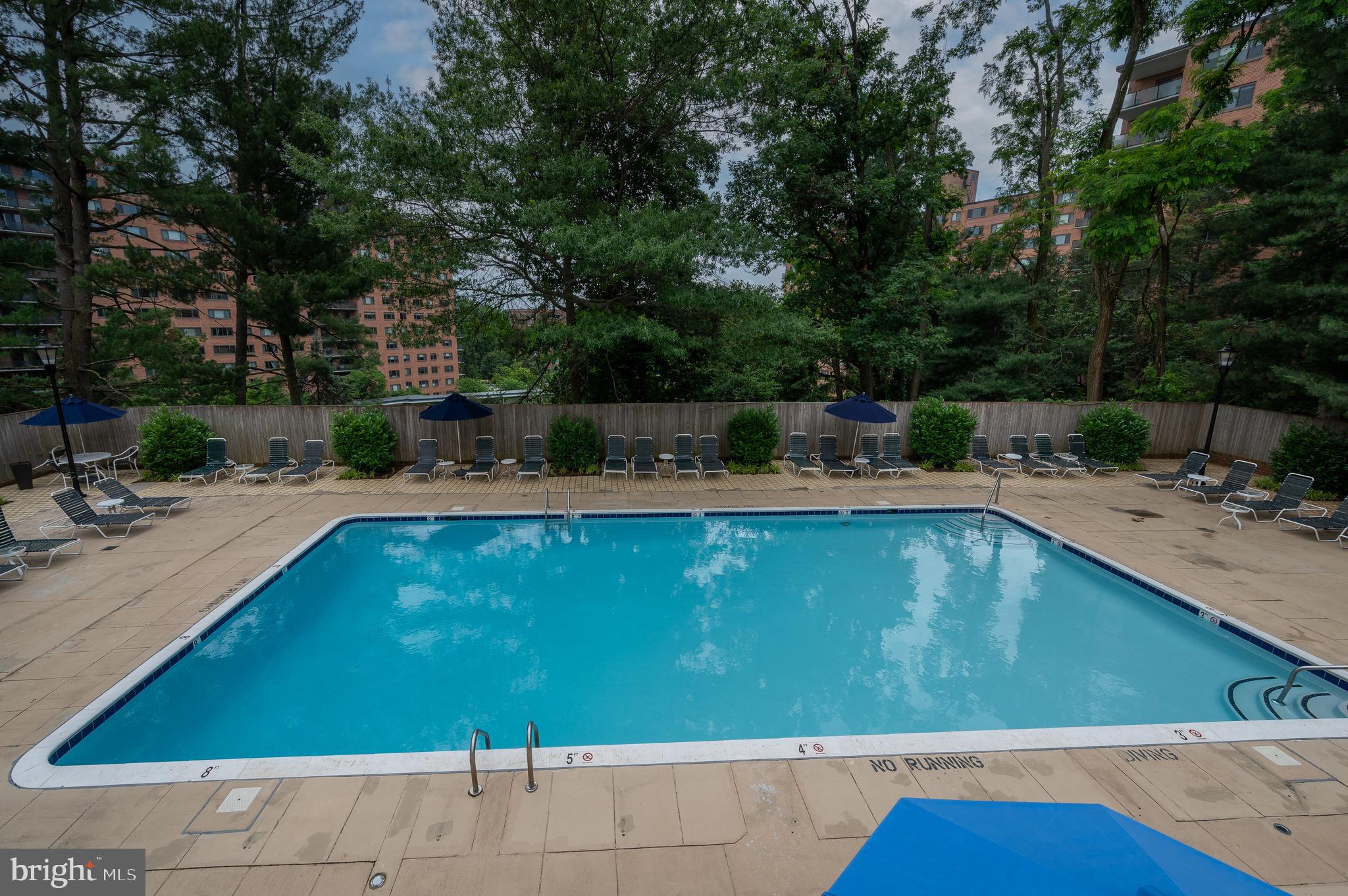 3265 Sutton Place Northwest, Unit B Washington, DC 20016 - Photo 40 of 45 a view of a swimming pool with a patio