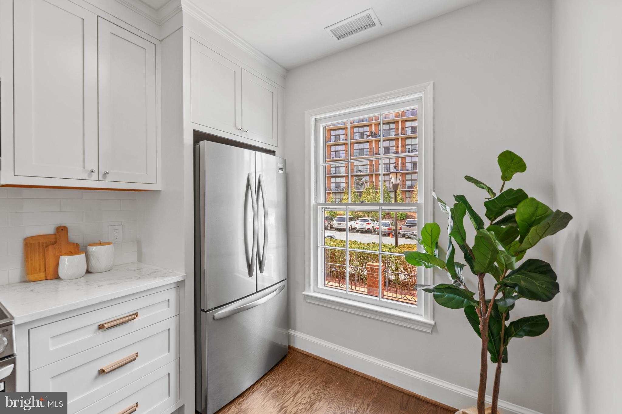 3265 Sutton Place Northwest, Unit B Washington, DC 20016 - Photo 7 of 45 a white refrigerator freezer sitting in a kitchen