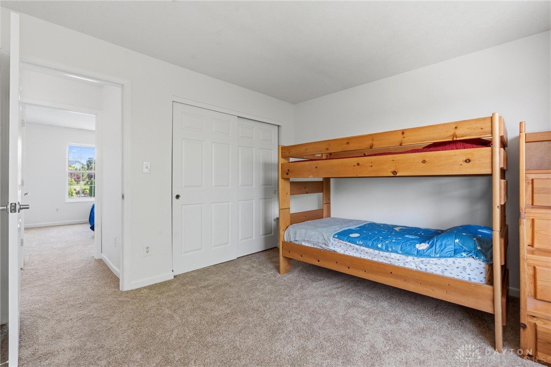 70 Martin Lane Springboro, OH 45066 - Photo 34 of 69 This spacious bedroom offers ample natural light and plush carpeting, perfect for peaceful slumber.