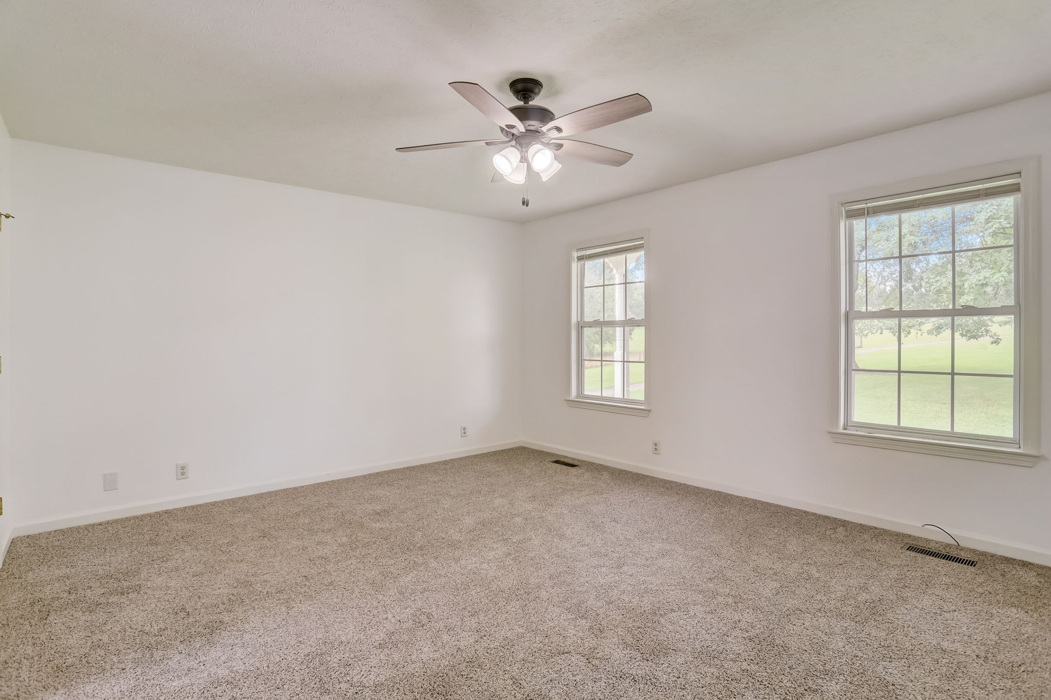 308 Ranch Road Portland, TN 37148 - Photo 11 of 43 an empty room with chandelier fan and windows
