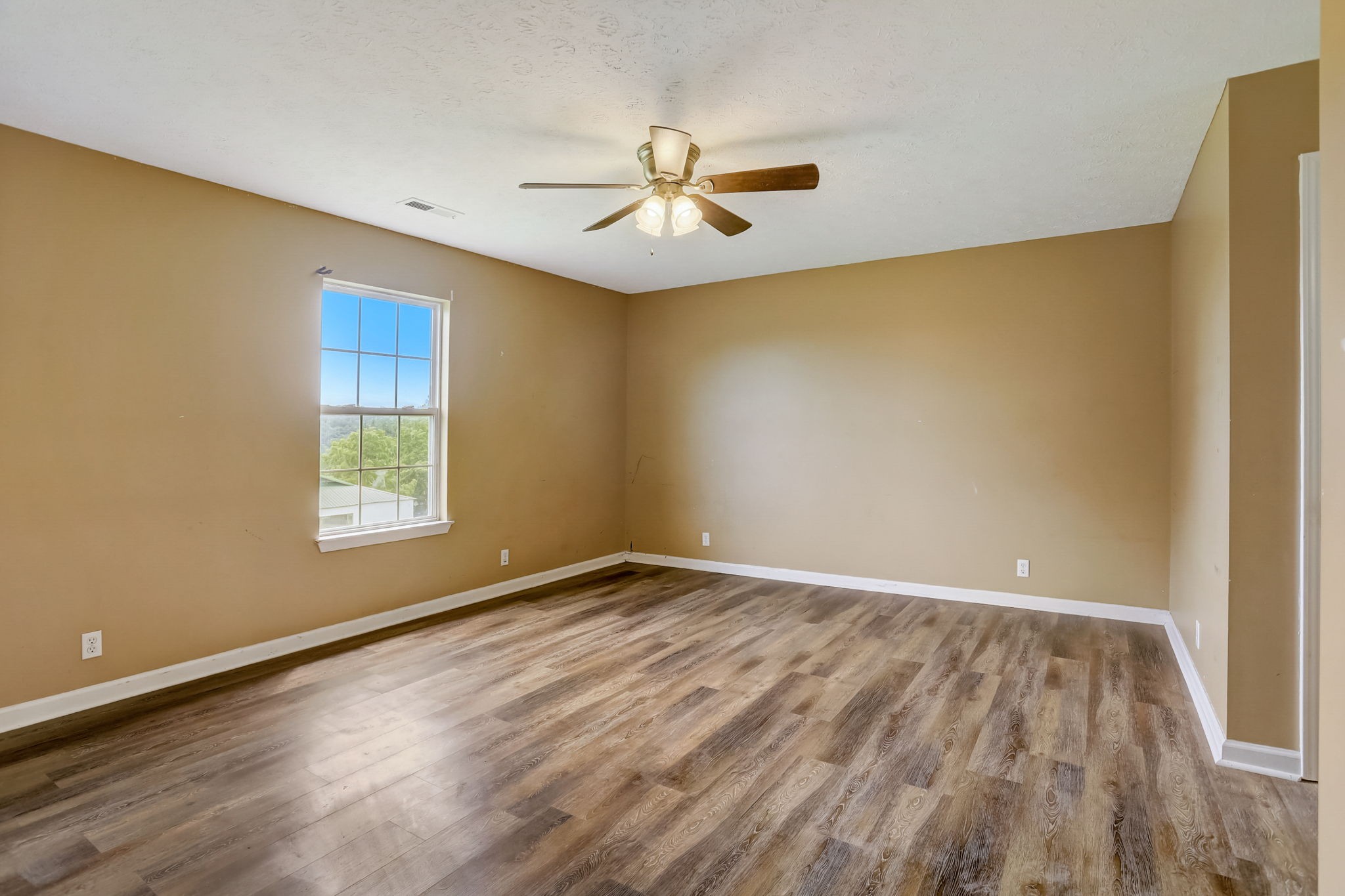 308 Ranch Road Portland, TN 37148 - Photo 17 of 43 wooden floor in an empty room with a window