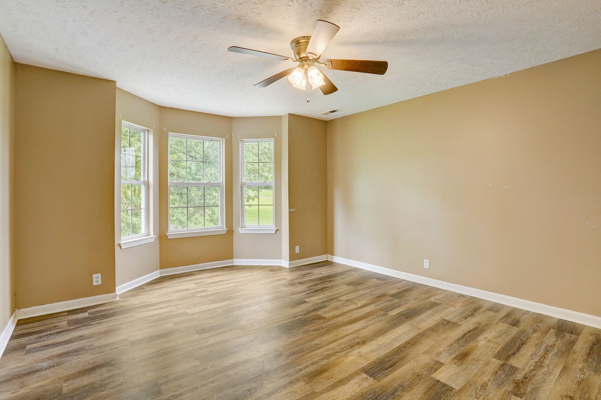 308 Ranch Road Portland, TN 37148 - Photo 21 of 43 a view of an empty room with window and a ceiling fan