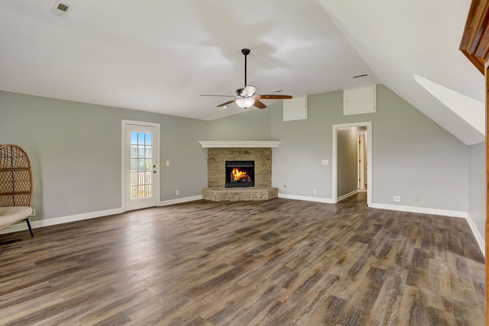 308 Ranch Road Portland, TN 37148 - Photo 25 of 43 a view of an empty room with wooden floor fireplace and a window