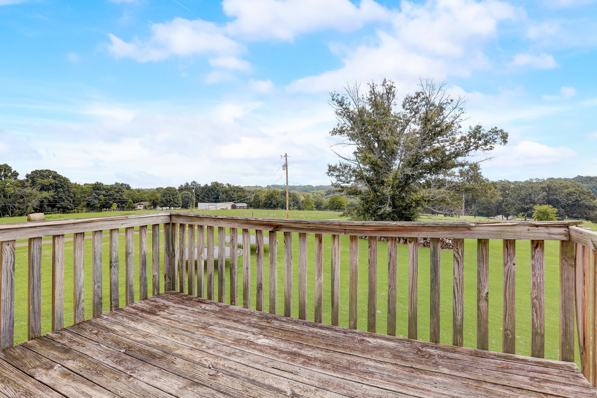 308 Ranch Road Portland, TN 37148 - Photo 27 of 43 a balcony with wooden floor and fence