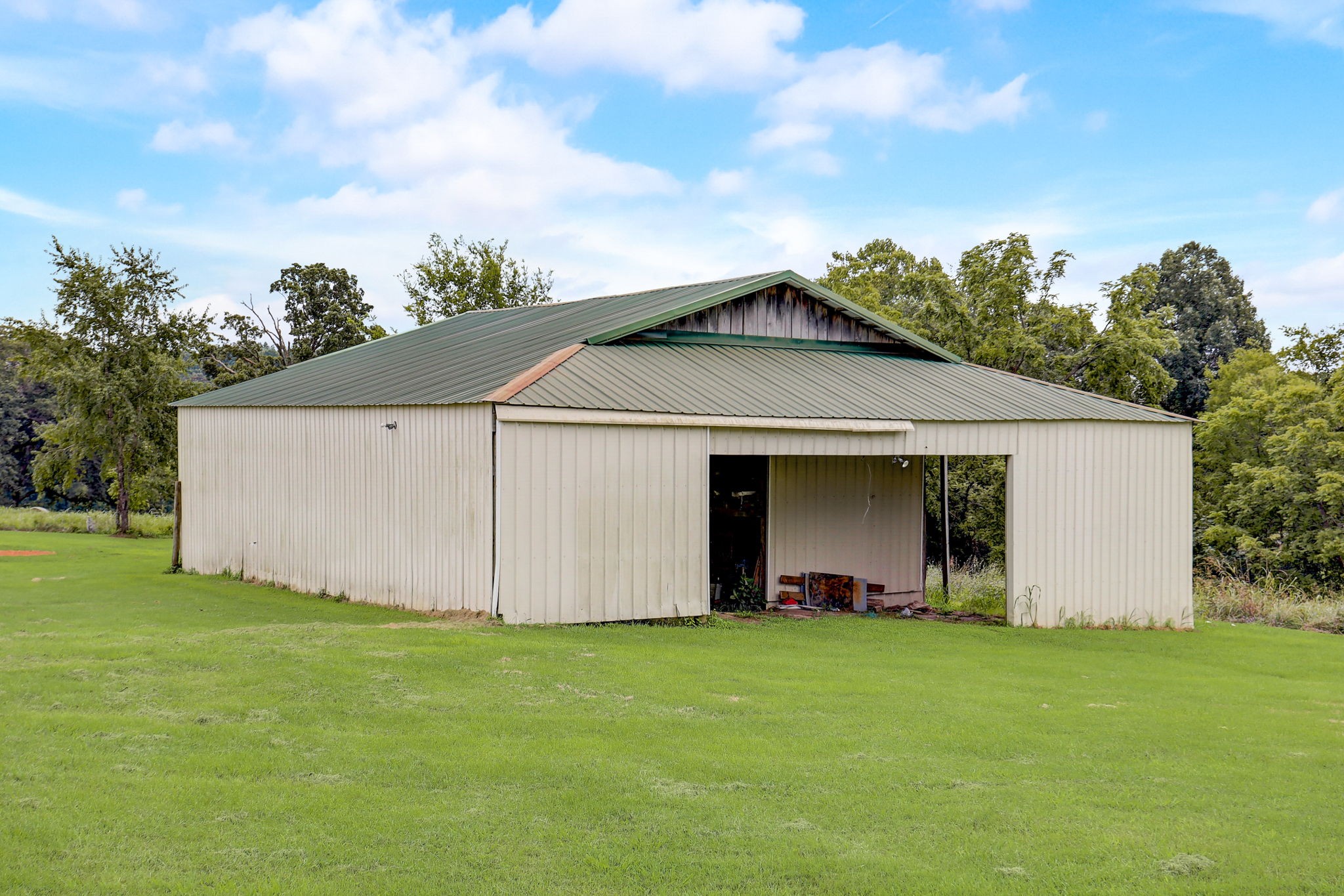 308 Ranch Road Portland, TN 37148 - Photo 34 of 43 a view of a backyard with potted plants and large tree