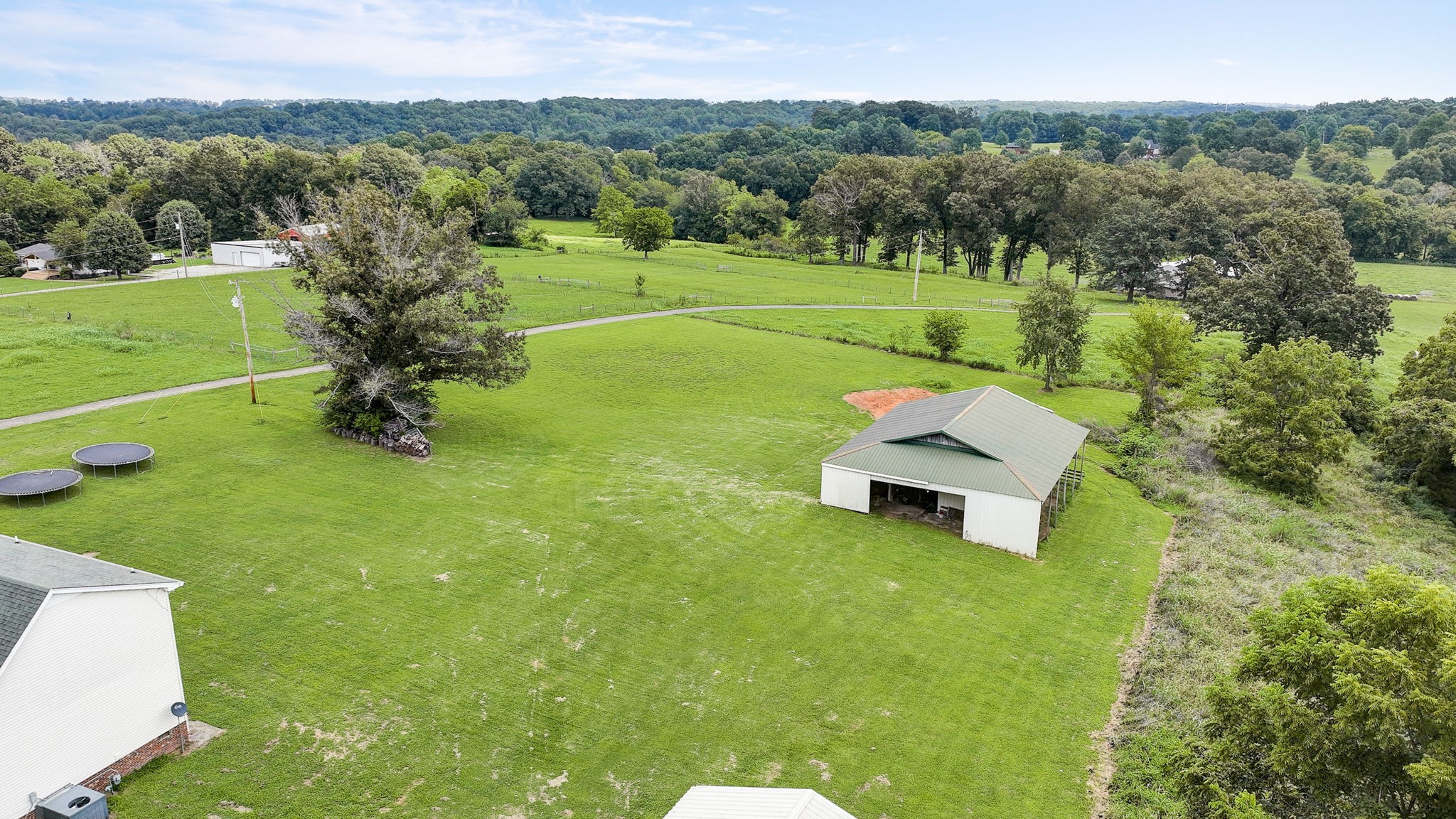 308 Ranch Road Portland, TN 37148 - Photo 39 of 43 a garden with trees in the background