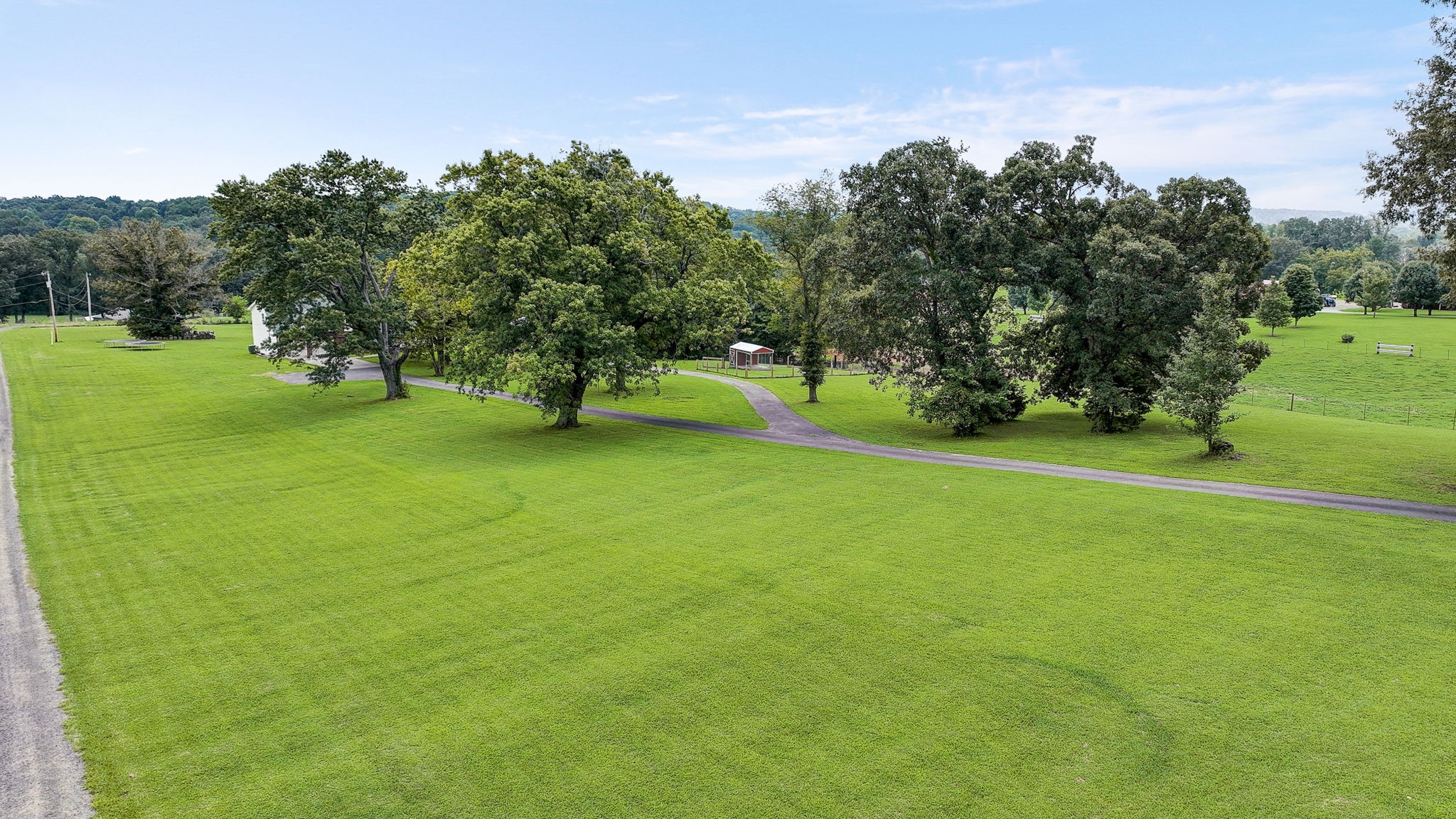 308 Ranch Road Portland, TN 37148 - Photo 40 of 43 a view of a field of grass and trees