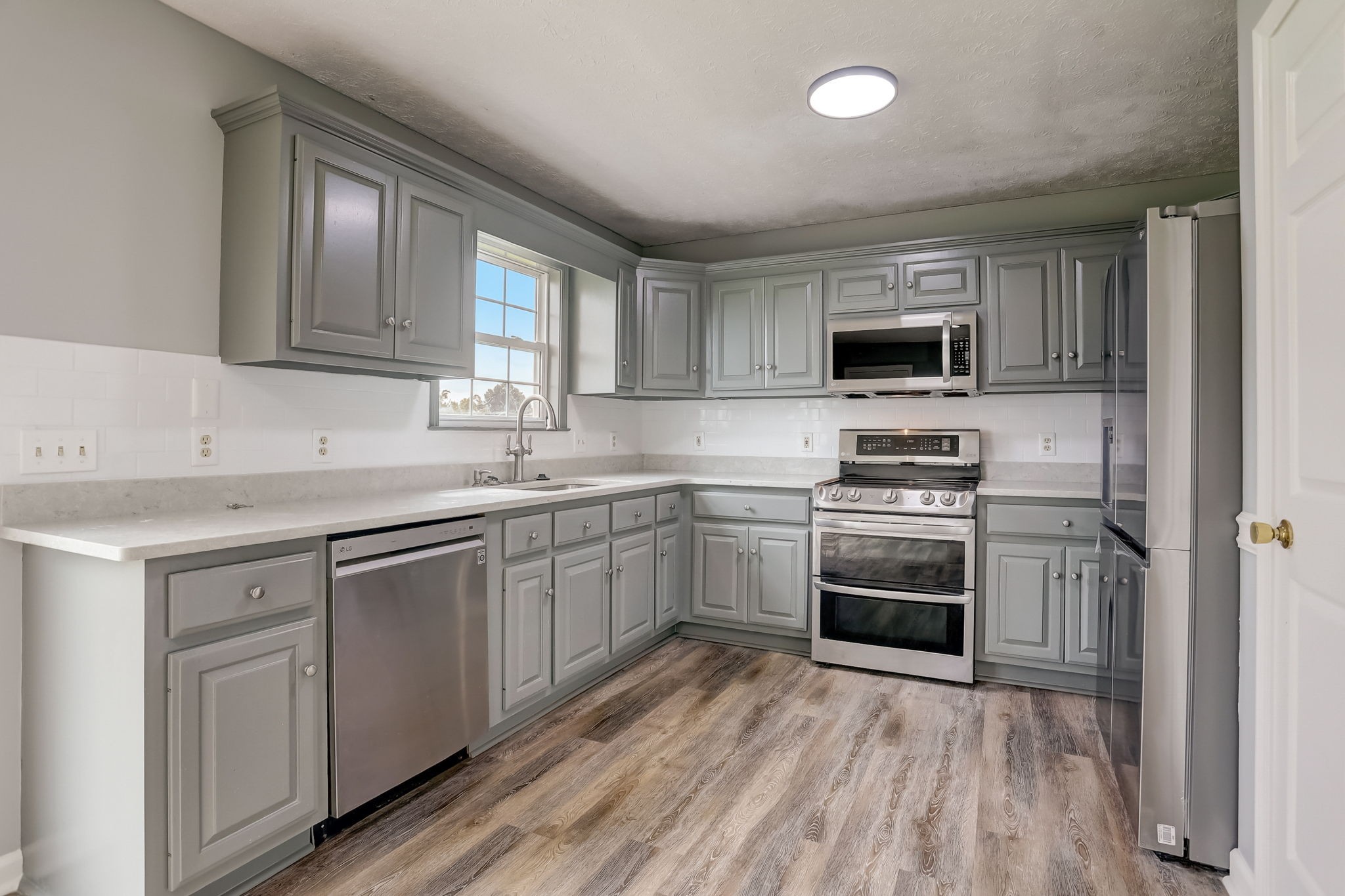 308 Ranch Road Portland, TN 37148 - Photo 9 of 43 a kitchen with a sink appliances and cabinets