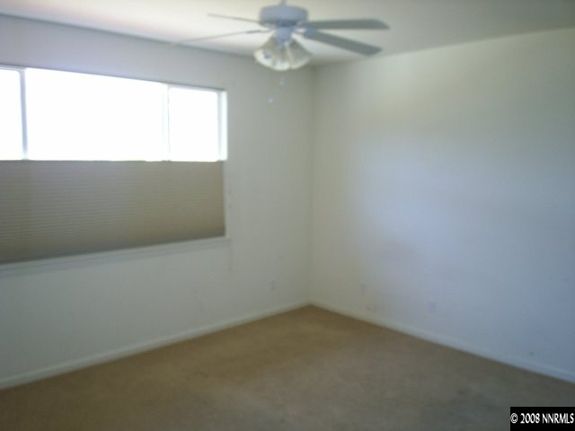 10653 Fire Poppy Circle Reno, NV 89521 - Photo 5 of 9 an empty room with a window