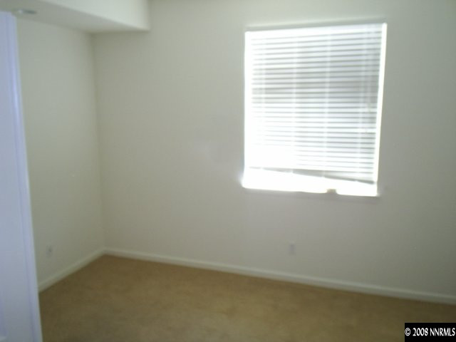 10653 Fire Poppy Circle Reno, NV 89521 - Photo 7 of 9 an empty room with a window