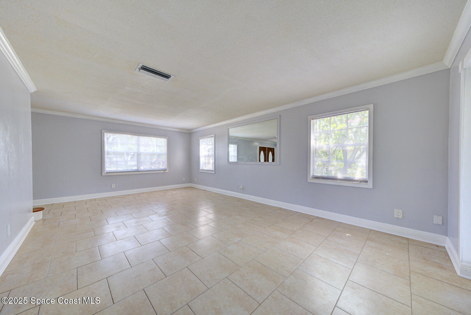 949 Brunswick Lane Rockledge, FL 32955 - Photo 11 of 43 a view of an empty room with a window