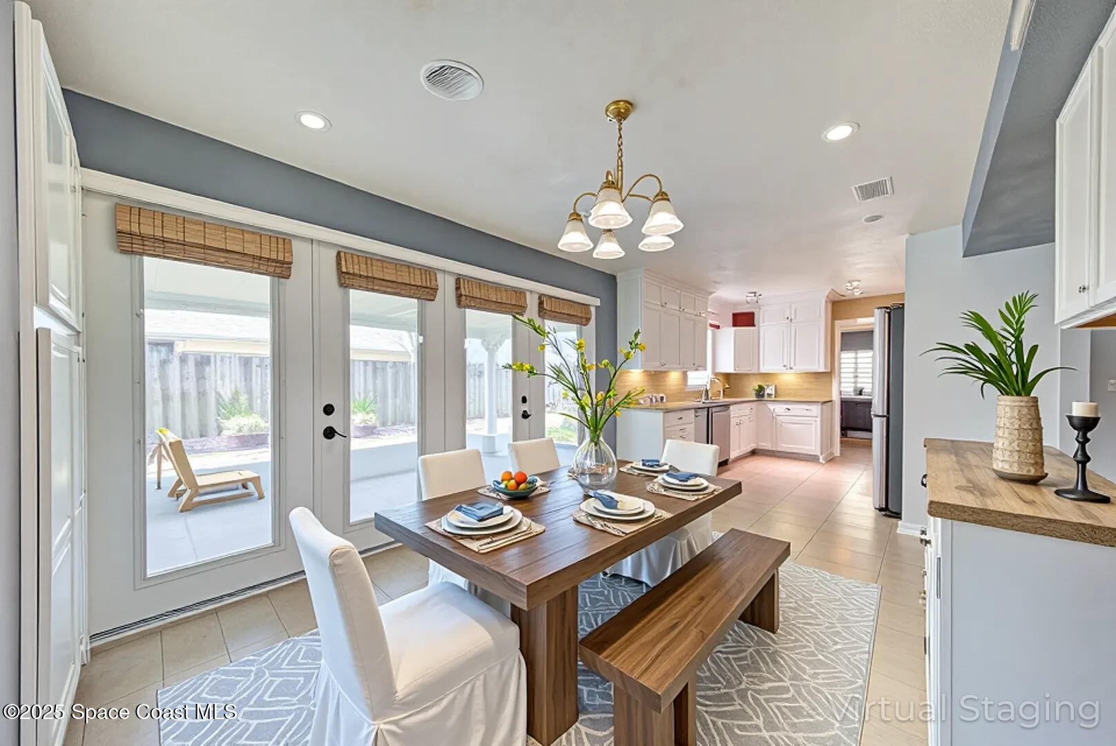 949 Brunswick Lane Rockledge, FL 32955 - Photo 13 of 43 a view of a dining room with furniture wooden floor and chandelier